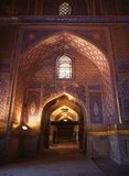 The Registan contains three madrasahs (schools), the Ulugh Beg Madrasah (1417–1420), Tilya-Kori Madrasah (1646–1660) and the Sher-Dor Madrasah (1619–1636).<br/><br/>

The Tilya-Kori Madrasah was built in the mid-17th century by the Shaybanid Amir Yalangtush. The name Tilya-Kori means ‘gilded’ or ‘gold-covered’, and the entire building is lavishly decorated with elaborate geometrical arabesques and sura from the Qur’an both outside and especially within. A magnificent turquoise dome rises over the left (western) side of the building, decorated inside with gilded Qur’anic inscriptions and delicate muqarnas hanging ‘stalactite’ decorations. The interior of the madrasah comprises rooms for students with accompanying vestibules surrounding three-sides of a square courtyard, while a domed mosque occupies the fourth.<br/><br/>

The dome rises in four stages. A rectangular plinth forms the primary prayer hall and rises above the madrasa walls. Next, two terraced octagonal tiers rise to support a high cylindrical drum. The dome's monochrome blue color contrasts pleasingly with the drum's polychrome decoration formed by bands of Arabic calligraphy taken from the Qur’an.